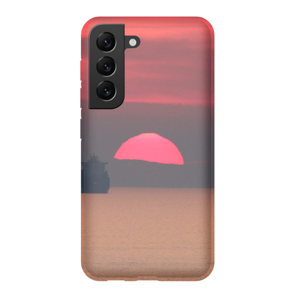 Premium cell phone case featuring Sam Gilliss Visual Arts' "Ship at Sunset, Corsica" design with Mediterranean coast imagery.