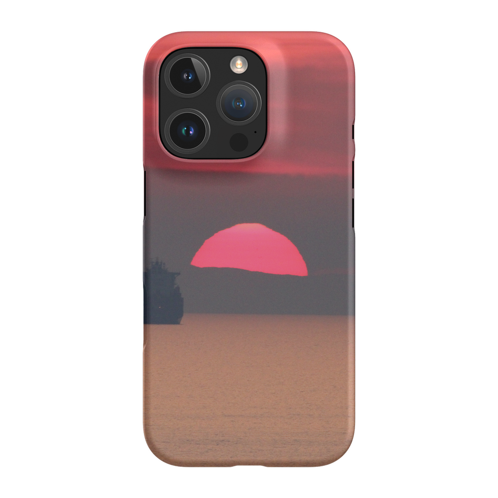 Premium cell phone case featuring Sam Gilliss' "Ship at Sunset, Corsica" artwork with a Mediterranean coast scene.