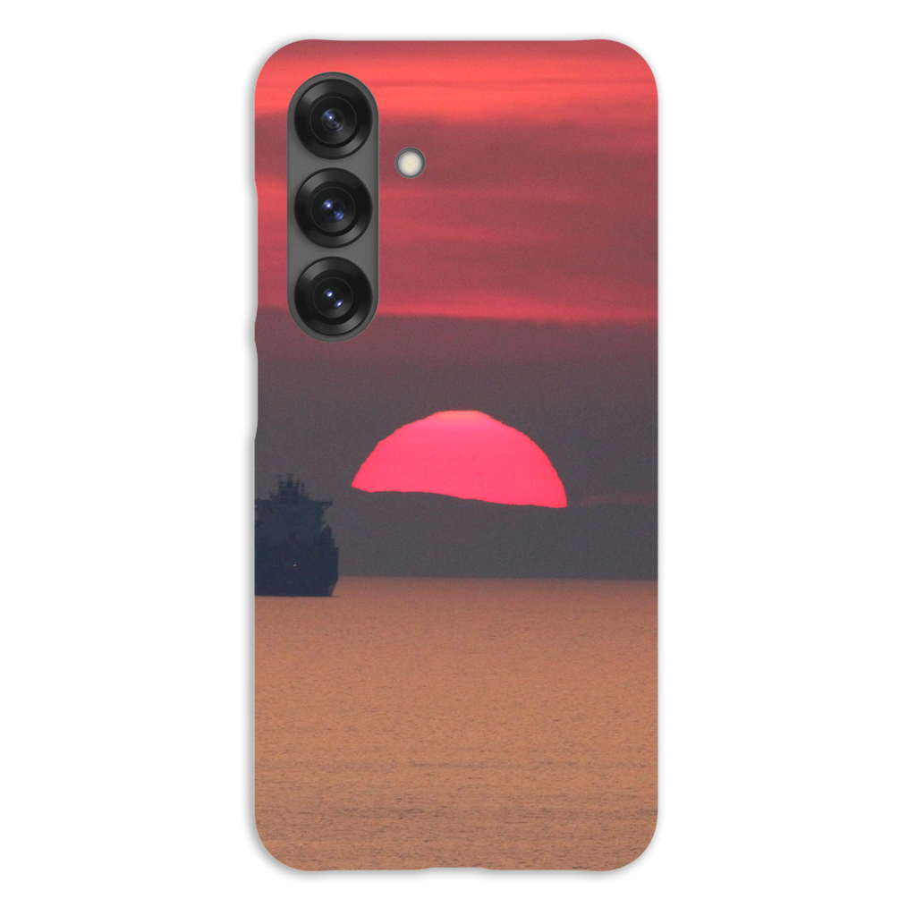 Premium cell phone case featuring Sam Gilliss Visual Arts' "Ship at Sunset, Corsica" with Mediterranean coast scene.