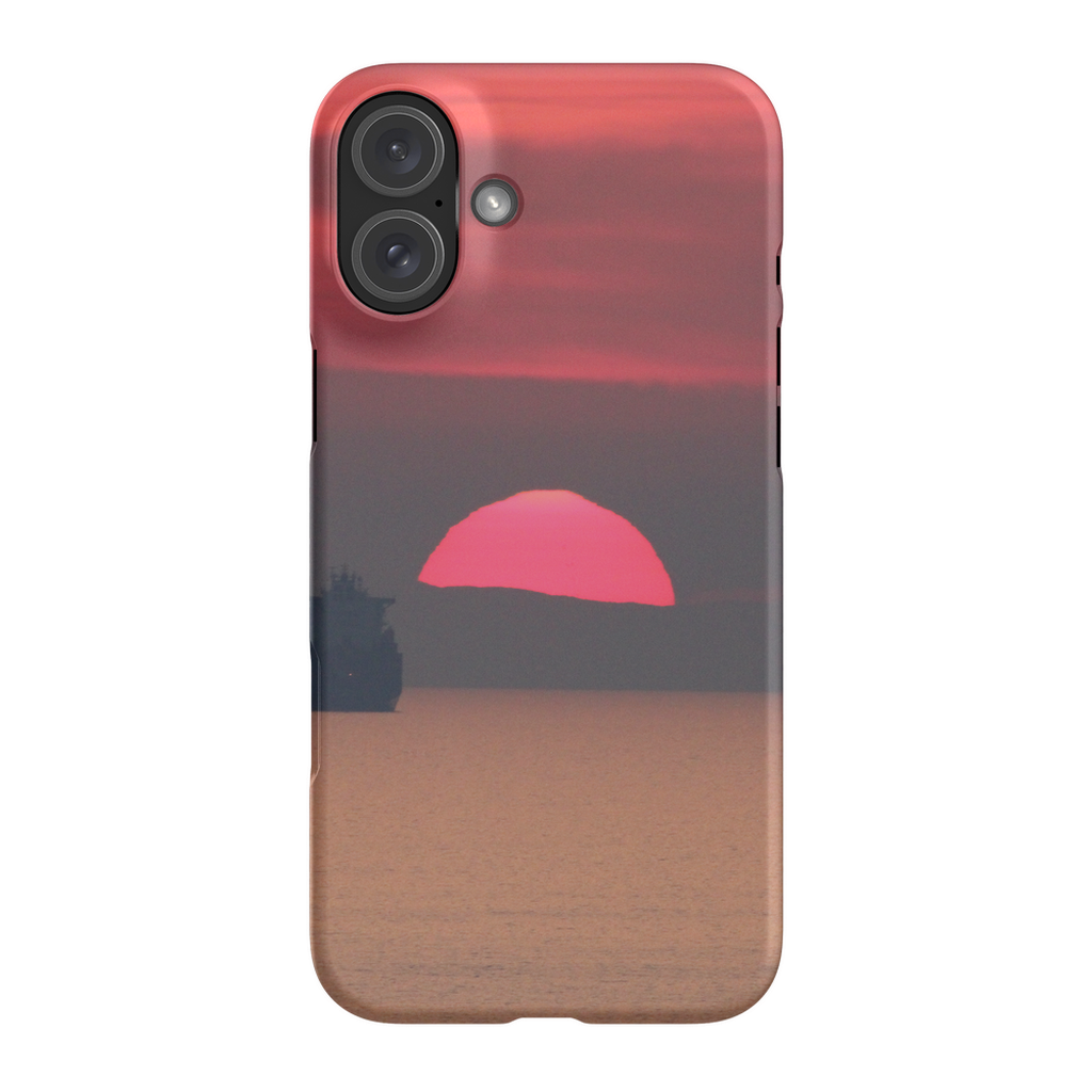 Premium cell phone case featuring Sam Gilliss' "Ship at Sunset, Corsica" art with a Mediterranean coast scene on a sleek protective cover.
