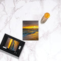 Makena Beach Sunset Puzzle by Sam Gilliss, featuring Molokini Crater after the storm, 110-1000 piece coastal art jigsaw puzzle.