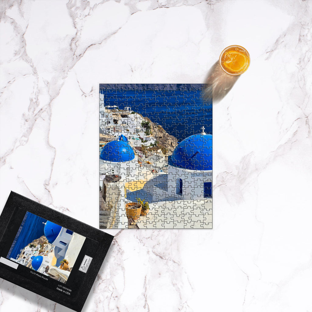 Sam Gilliss Visual Arts Santorini Blue Domes puzzle featuring Oia Greece landscape with colorful blue-domed buildings, 1000-piece fine art jigsaw