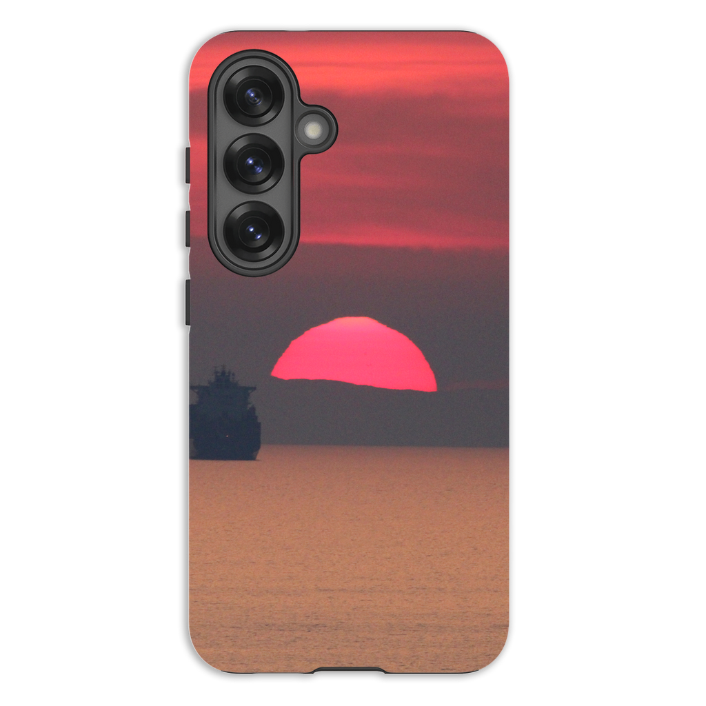 Premium cell phone case featuring a Ship at Sunset scene from Corsica, with vibrant Mediterranean coast artwork by Sam Gilliss Visual Arts.
