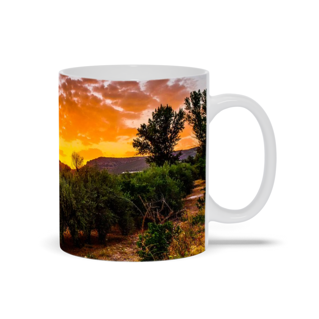 11oz ceramic coffee mug featuring a sunset over olive groves in Central Spain, by Sam Gilliss Visual Arts.