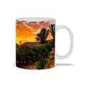 Ceramic coffee mug featuring a sunset over olive groves in Central Spain, with vibrant landscape artwork by Sam Gilliss Visual Arts.